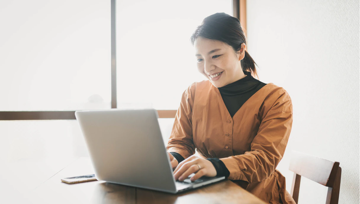 Female investor looking at laptop